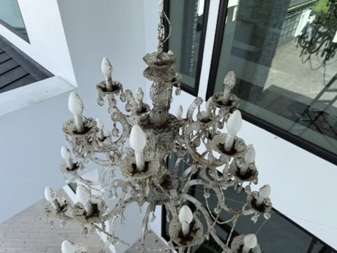 Cleaning a grand gold chandelier