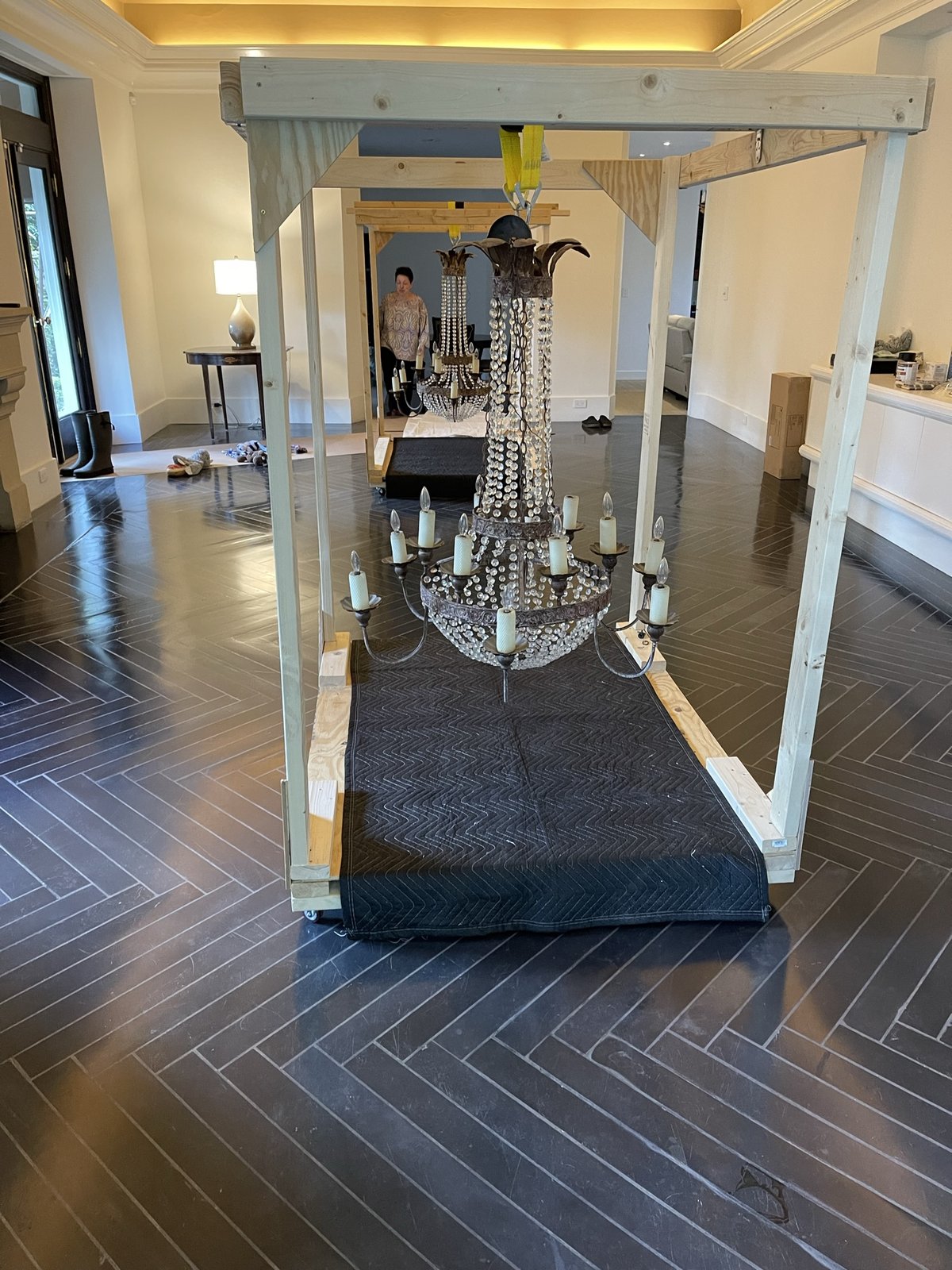 Chandelier suspended from a gantry rack for crating