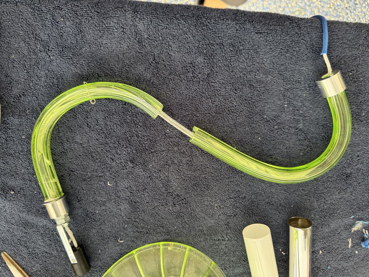 Repairing a green glass chandelier arm